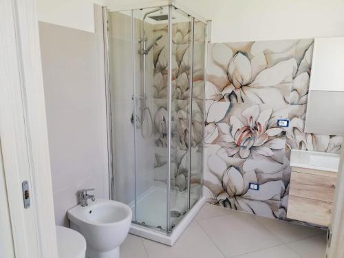 a bathroom with a shower and a toilet and a sink at Residence Tre Gemme in Trapani