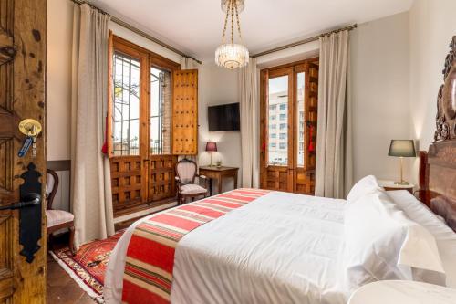 Postel nebo postele na pokoji v ubytování Alquería Calatrava B&B