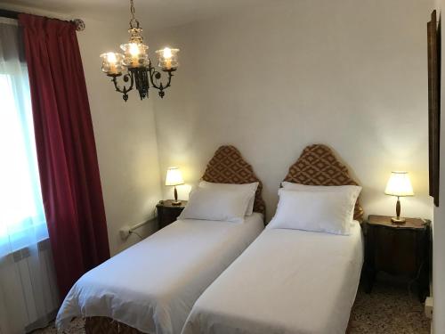 two beds sitting next to each other in a bedroom at PIAN DEL LECCIONE in Manciano