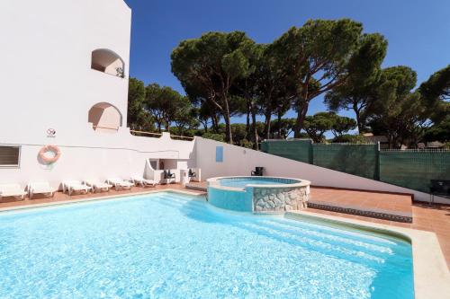 a pool at a villa with a swimming pool at Green paradise T2 apartment with pool top floor in Albufeira