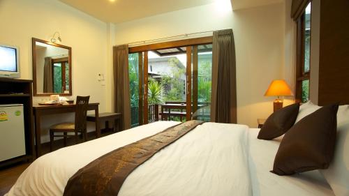 Säng eller sängar i ett rum på Dreamville Koh Phangan