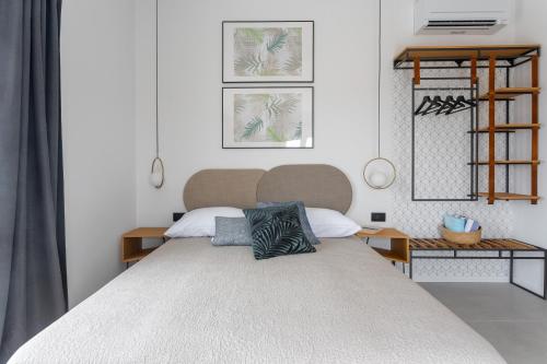a bedroom with a large bed with two pillows on it at Hvar Top View Apartments in Hvar