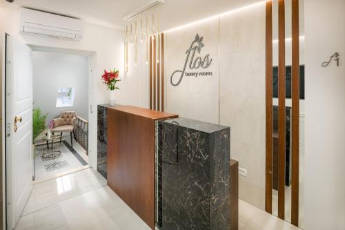 a lobby with a reception desk in a room at Flos Luxury Rooms in Split
