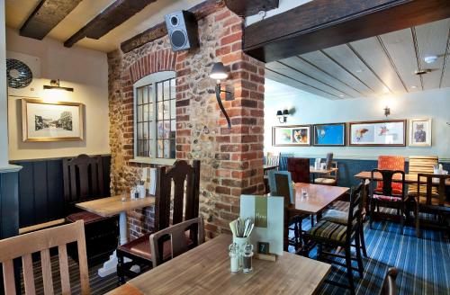 A restaurant or other place to eat at The Fox by Greene King Inns 