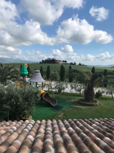 a view from the roof of a house with a playground at Le case della baracchina in Pisa