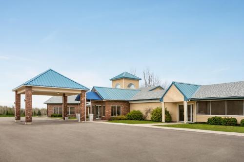 a row of houses with blue roofs at Days Inn & Suites by Wyndham Moncton in Moncton