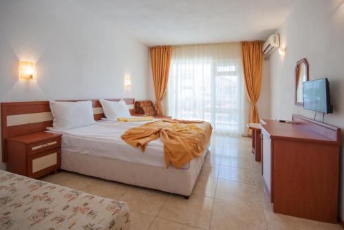Postel nebo postele na pokoji v ubytování Stefanov 2 Hotel