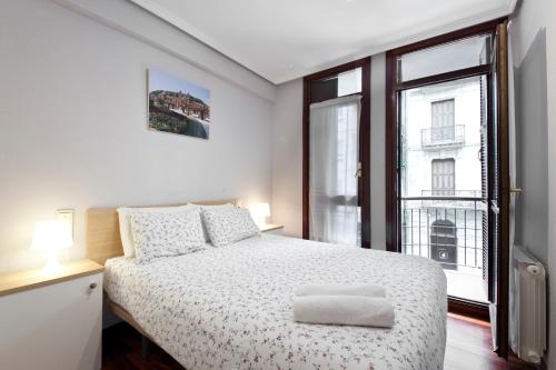 Posteľ alebo postele v izbe v ubytovaní City Beach Living