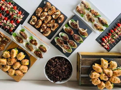 a table topped with plates of food and bowls of food at Mont d'Or Monte Bello Estate in Bloemfontein