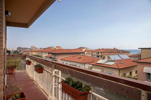 a view of a city from a balcony at Appartamento Alex Vista Mare in Lido di Camaiore