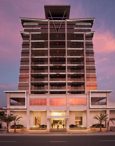 a rendering of a building with palm trees in front at Midas Hotel and Casino in Manila