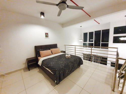 a bedroom with a bed and a ceiling fan at Yenni Duplex @ DeCentrum, Kajang in Seri Kembangan