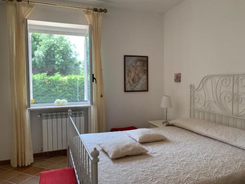 Ένα ή περισσότερα κρεβάτια σε δωμάτιο στο Villa Aurora