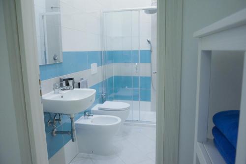 a bathroom with a sink and a toilet at Luna Chiara Home in Sant'Agnello