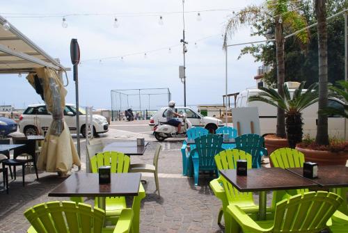 a group of tables and chairs on a patio at B&B Vicomare in Crotone