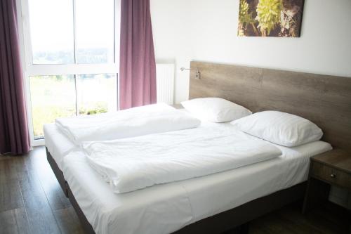 Säng eller sängar i ett rum på Resort Winterberg, Winterberg-Neuastenberg