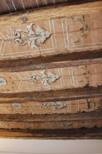 a wooden box with a painting on the ceiling at I Soffitti Dimora Esclusiva in Tropea