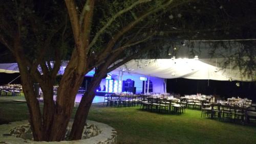 a room with tables and chairs and a tree at Hotel Spa Hacienda Real la Nogalera in Tequisquiapan