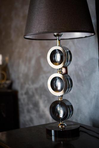 a lamp sitting on top of a table at Julina Boutique Living in Mosta