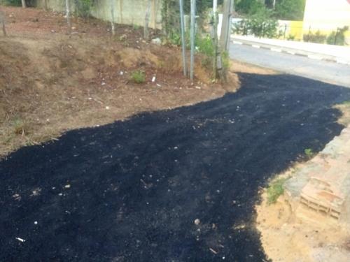 a road that has been patched with black asphalt at Dunas Apart Refugio Completo a 1Km Praia de St Antonio in Diogo