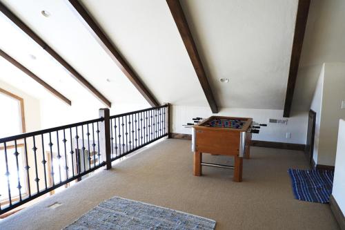 a attic room with a chess board on a table at Zion Ponderosa Ranch Resort in Springdale
