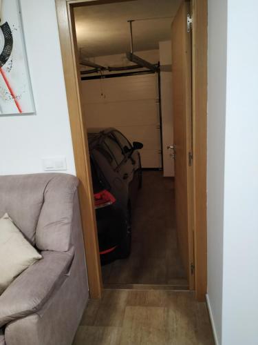 a living room with a couch and a closet at Casa da Xastra in Vimianzo