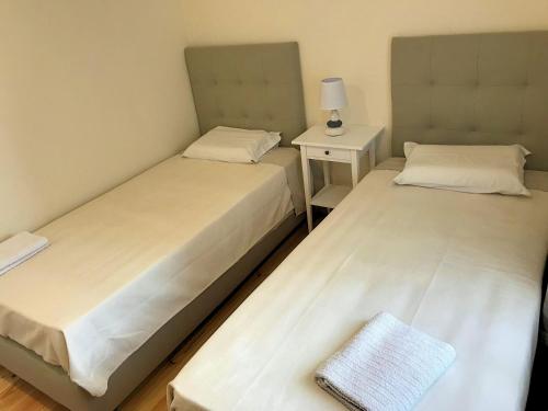 Ένα ή περισσότερα κρεβάτια σε δωμάτιο στο Caravela