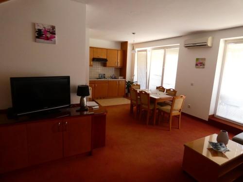 a living room with a kitchen and a dining room at Apartments Paradise in Moravske-Toplice