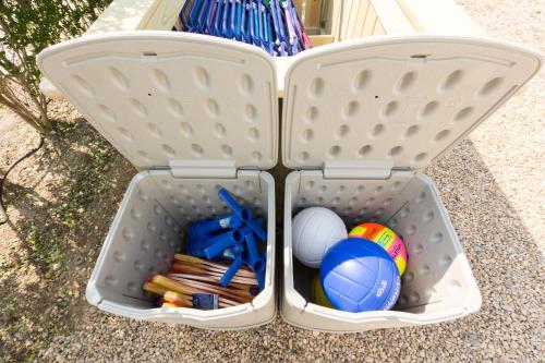 a white container with balls and toys in it at The Ocean Resort Inn in Montauk