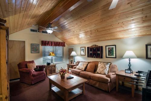 a living room with a couch and a table at 2A The Terry Cabin in North Wawona