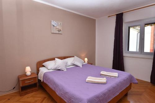 Postel nebo postele na pokoji v ubytování Apartments Katica