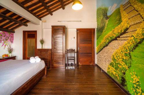 Postel nebo postele na pokoji v ubytování Calm House Hotel Hoi An 1