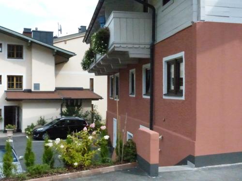 a house with a car parked in front of it at B&B by Zillners in Zell am See