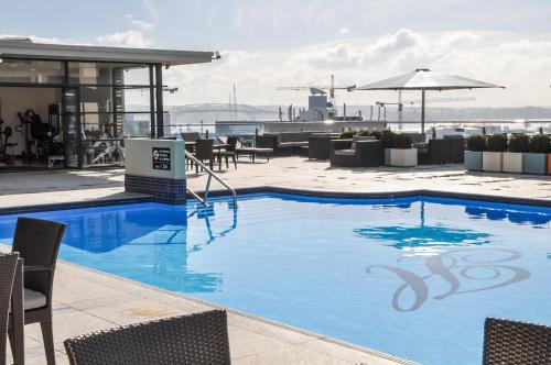 a large swimming pool on top of a building at Private apartments in a Landmark Heritage Building in Auckland