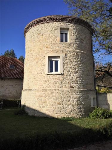a large brick building with two windows on it at Chambres d'Hotes Lorengrain in Bruyères-et-Montbérault