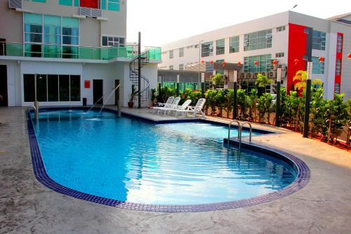 a large swimming pool in front of a building at 906 Premier Hotel in Melaka