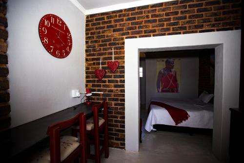 Katil atau katil-katil dalam bilik di Inyameko BnB