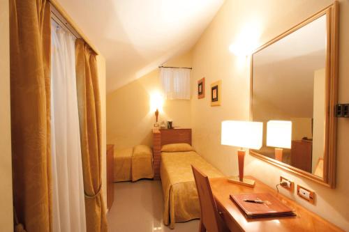 Postel nebo postele na pokoji v ubytování Hotel Tirreno