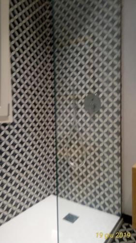 a shower with a glass door in a bathroom at oltremare soul houses in Chiavari