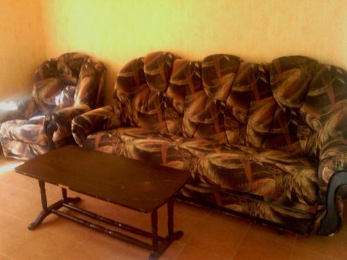 a couch with a coffee table in a living room at Nirvana Resort in Sevan