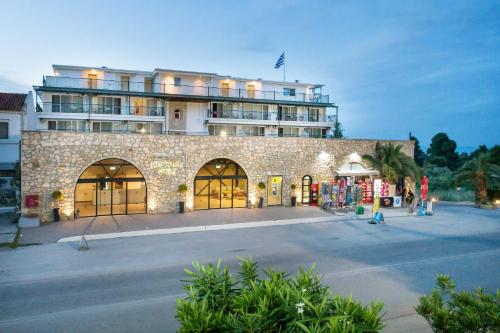 a large building with a lot of windows at Hotel Kriopigi in Kriopigi