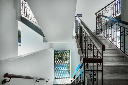 a staircase with a stained glass window in a building at Hotel Kriopigi in Kriopigi