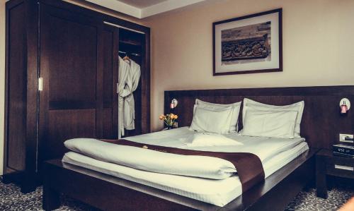 Een bed of bedden in een kamer bij Hotel Cherica