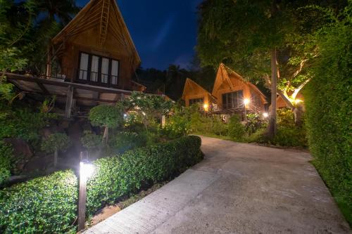 a pathway leading to a house at night at The Cove Phi Phi in Phi Phi Don