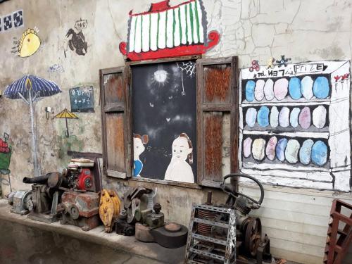 a shop with an old engine sitting on a shelf at Stash in Bangkok