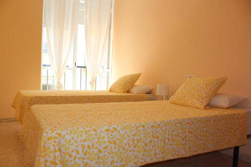 En eller flere senge i et værelse på Renovado y muy cerca del centro urbano