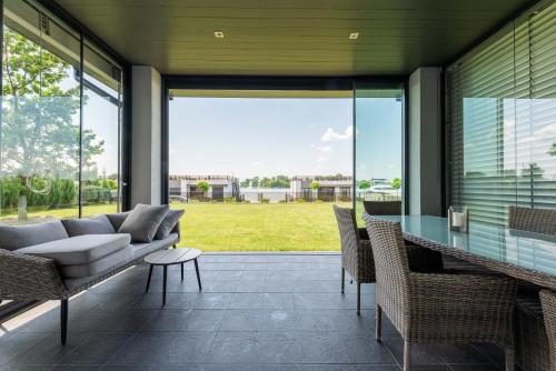 a living room with a couch and a table at Riviera Zoloche Resort & Spa in Vishenki