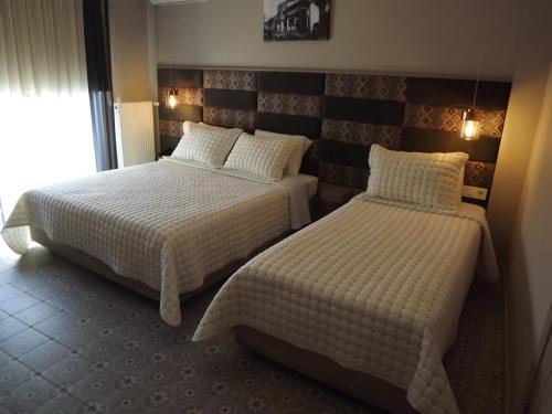 a hotel room with two beds and a window at ACR PALAS in Edirne