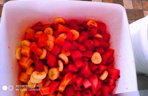 a white bowl filled with red peppers and carrots at Kensington Suites in Bengaluru