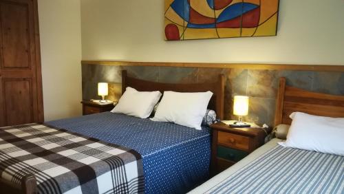 Ліжко або ліжка в номері Casa da Fonte Sagrada